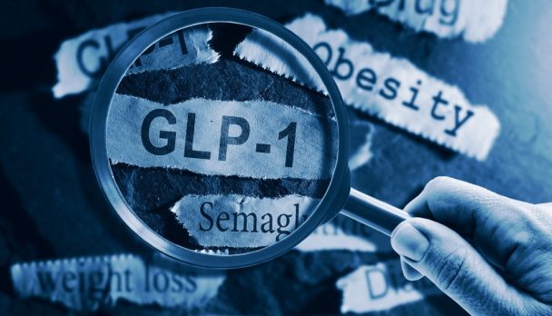 Glp-1,Related,Drugs,Newspaper,Headlines,With,Hand,And,Magnifying,Glass
